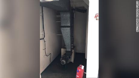 A dog unit found the man hiding in an air-conditioning unit on the cargo ship.