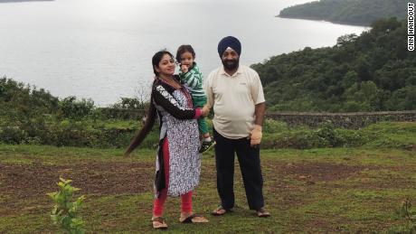 Lakhjeet Singh, 68, tested positive for Covid-19 but couldn&#39;t find a hospital to admit him. He is pictured with his daughter and granddaughter.