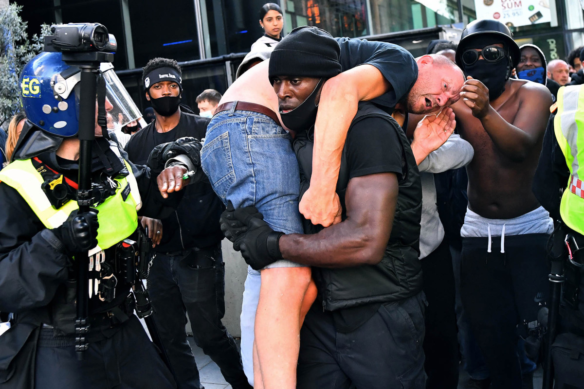 Black protester who carried white man to safety tried to avoid 'catastrophe'