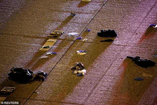 Articles of clothing and other items are seen strewn on Interstate 5 in Seattle after the collision early on Saturday morning