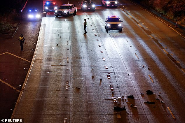 The image above shows the aftermath of the collision on Interstate 5 in Seattle as Washington State Troopers investigate