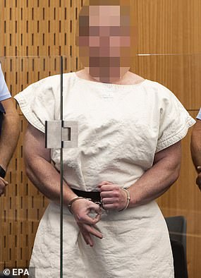 Brenton Tarrant, the Australian man arrested for killing 51 people at mosques in New Zealand earlier this year, is seen above making the gesture in court in March