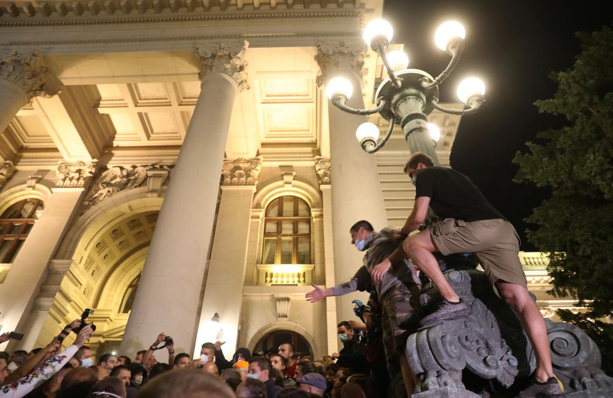 Demonstrators storm Serbian parliament in protest over lockdown