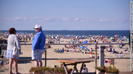 Beaches and bars are being shut down to discourage crowds during the Fourth of July weekend