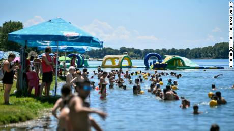Things are returning to normal in Italy. People swim in an artificial lake in Milan, on July 12.