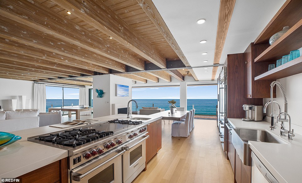 Kitchen goals: A galley kitchen comes with custom cabinetry and fixtures, as well as high-end commercial quality appliances