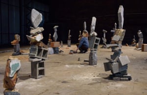 A man takes part in the “Balancing Rocks and Rubble” workshop by US artist Bridget Polk during the RIBOCA2 biennial Riga International Biennial of Contemporary Art titled “and suddenly it all blossoms” on August 29, 2020 at the art biennale’s grounds in Riga, Latvia.