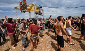 Up to 10,000 people dance and attend a rave party, on an agricultural land in Causse Mejean, in the heart of the Cevennes National Park, southern France on August 10, 2020, despite the limitation of gatherings linked to COVID-19, the novel coronavirus. Photo: Pascal Guyot / AFP