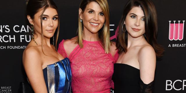 Lori Loughlin, center, with daughters Olivia Jade Giannulli, left, and Isabella Rose Giannulli. (Photo by Chris Pizzello/Invision/AP, File)