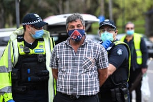 Police took away an anti-lockdown protestor in Melbourne on Saturday.