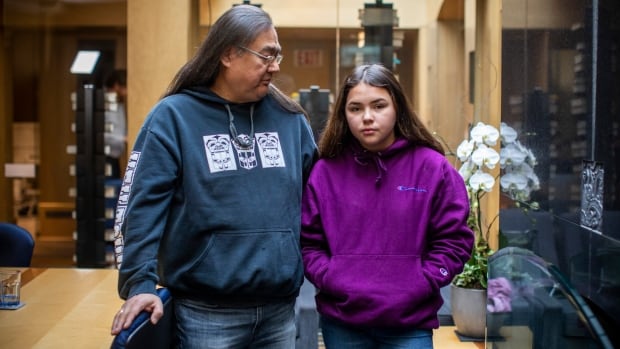An Aboriginal man and his handcuffed granddaughter at a Vancouver bank file a human rights complaint against the British police