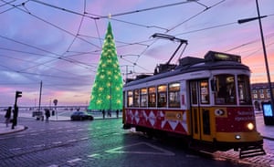 The tram passes through the fully lit Christmas tree in the semi-deserted Praça do Comercio.