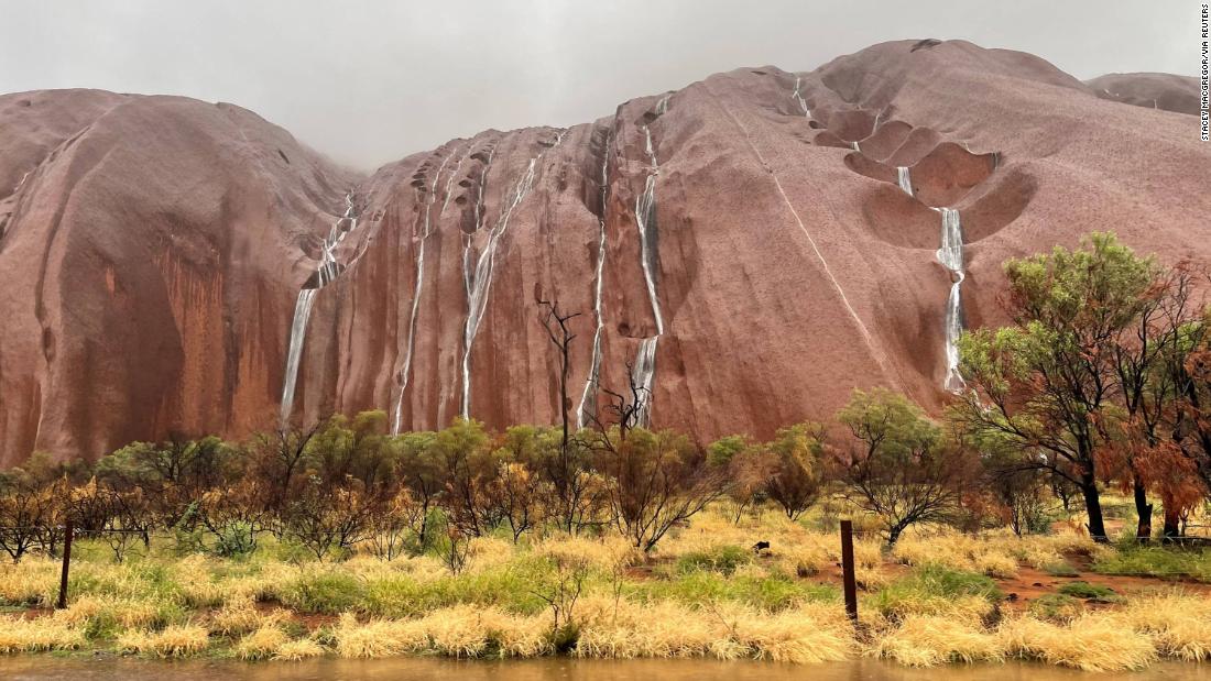 The water flows into Uluru after heavy rains in Northern Territory, Australia
