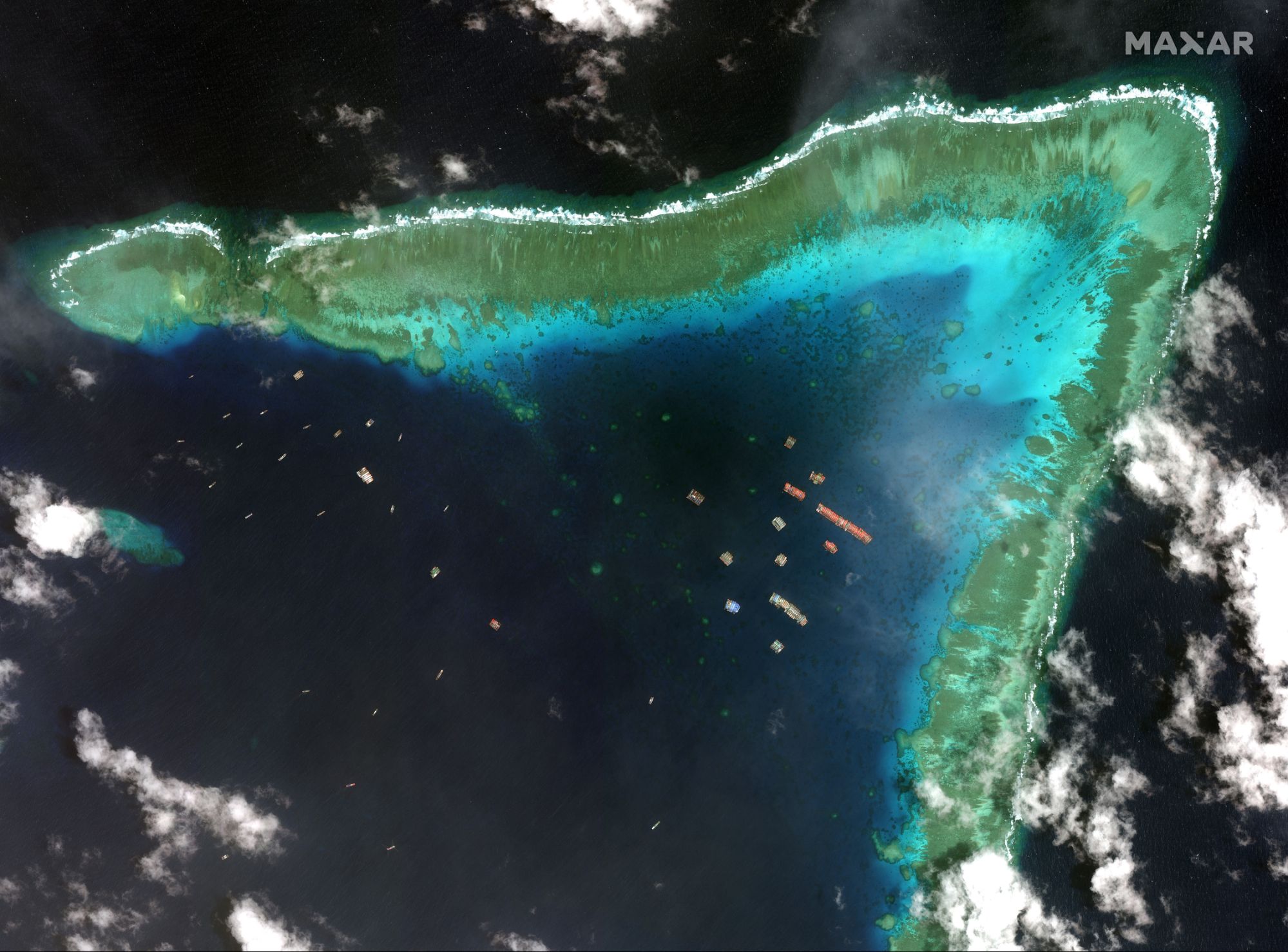 Philippine defense secretary in rhetoric with China over coral reefs