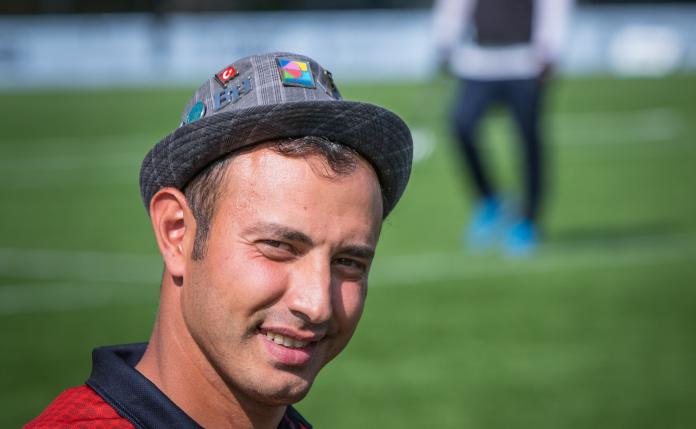 A photo of a Turkish archer wearing a hat