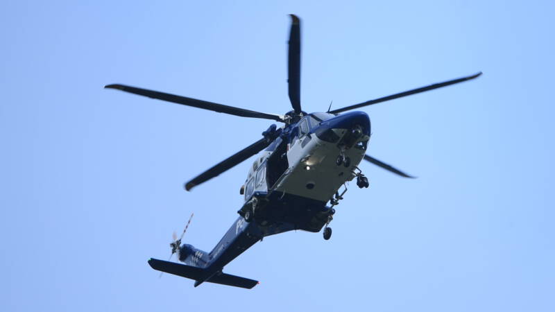 The New Zealand fugitive arranges a helicopter to surrender