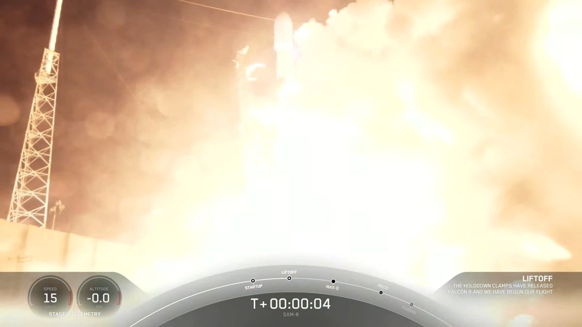 A SpaceX rocket launches a Sirius XM digital radio satellite, landing the sea at night
