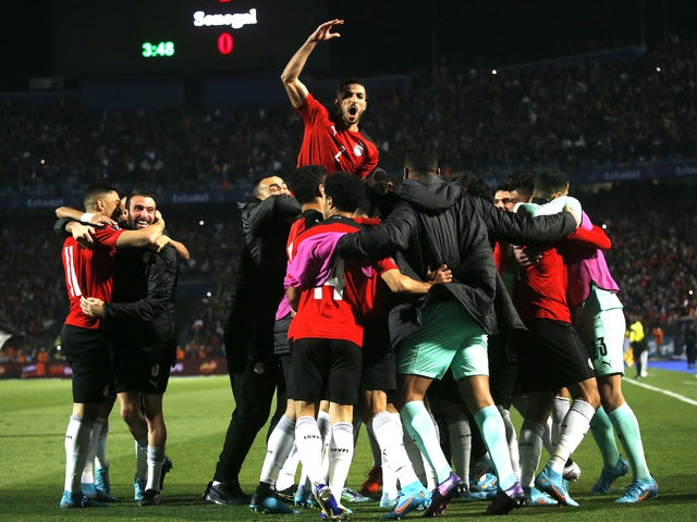 Egyptian players celebrate after Senegalese Salio Ciss scored an own goal on March 25, 2022