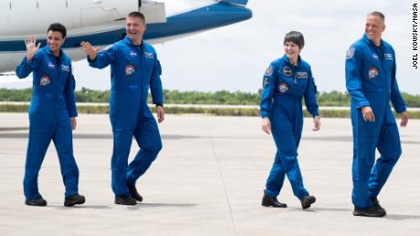 NASA astronaut Jessica Watkins, left, as Jill Lindgren, second from left, European astronaut Samantha Cristoforetti, second from right, and NASA astronaut Robert Haines, right, as they leave the NASA launch and landing facility.  Kennedy Space Center.