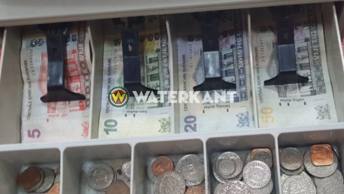 Cash register with money in Suriname