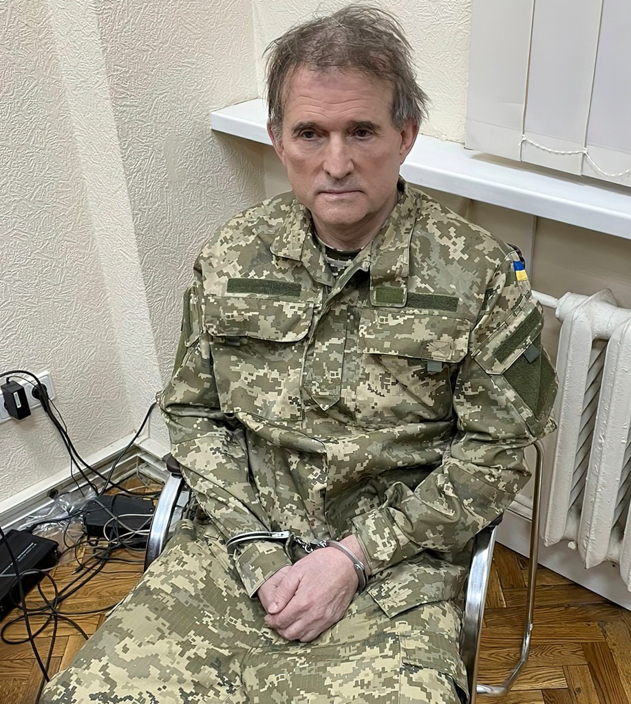 This photo from the Ukrainian Presidential Press Service shows oligarch Viktor Medvedchuk, the former leader of a pro-Russian opposition party and a confidant of Russian leader Vladimir Putin, handcuffed after his arrest during a special operation carried out by the country's intelligence services.  Intelligence agency, Tuesday, April 12, 2022, in Ukraine.