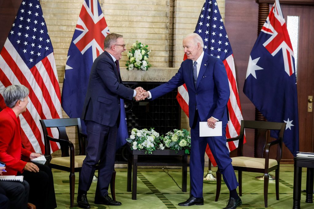US President Joe Biden and Australian Prime Minister Anthony Albany shake hands.