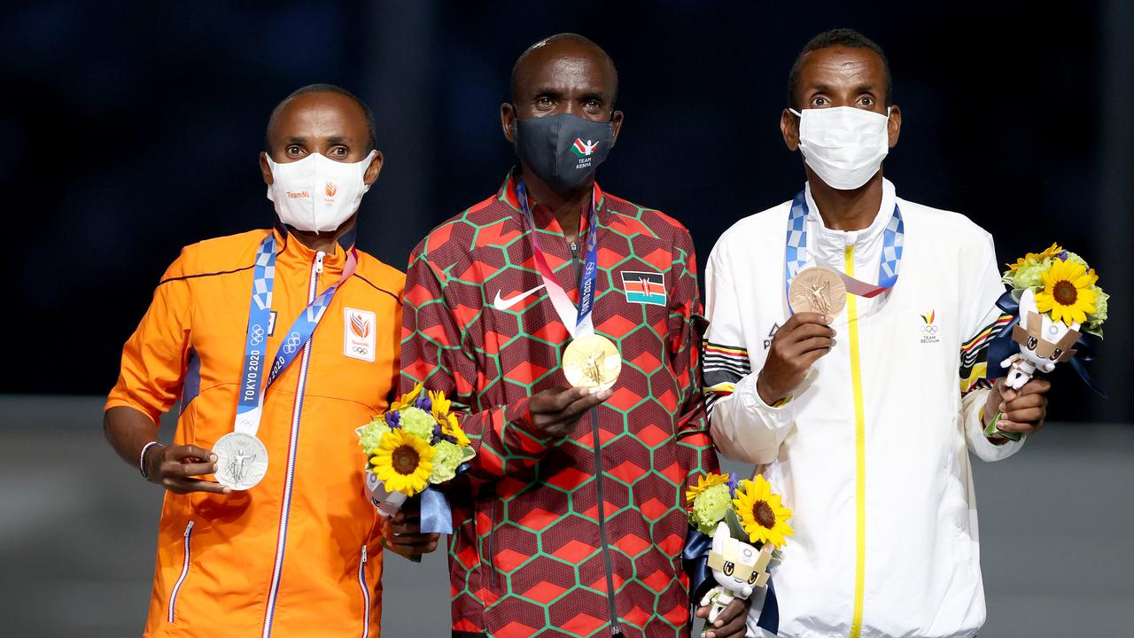 Olympic podium: Abdi Nagy (silver), Eliud Kipchoge (gold) and Bashir Abdi (bronze)