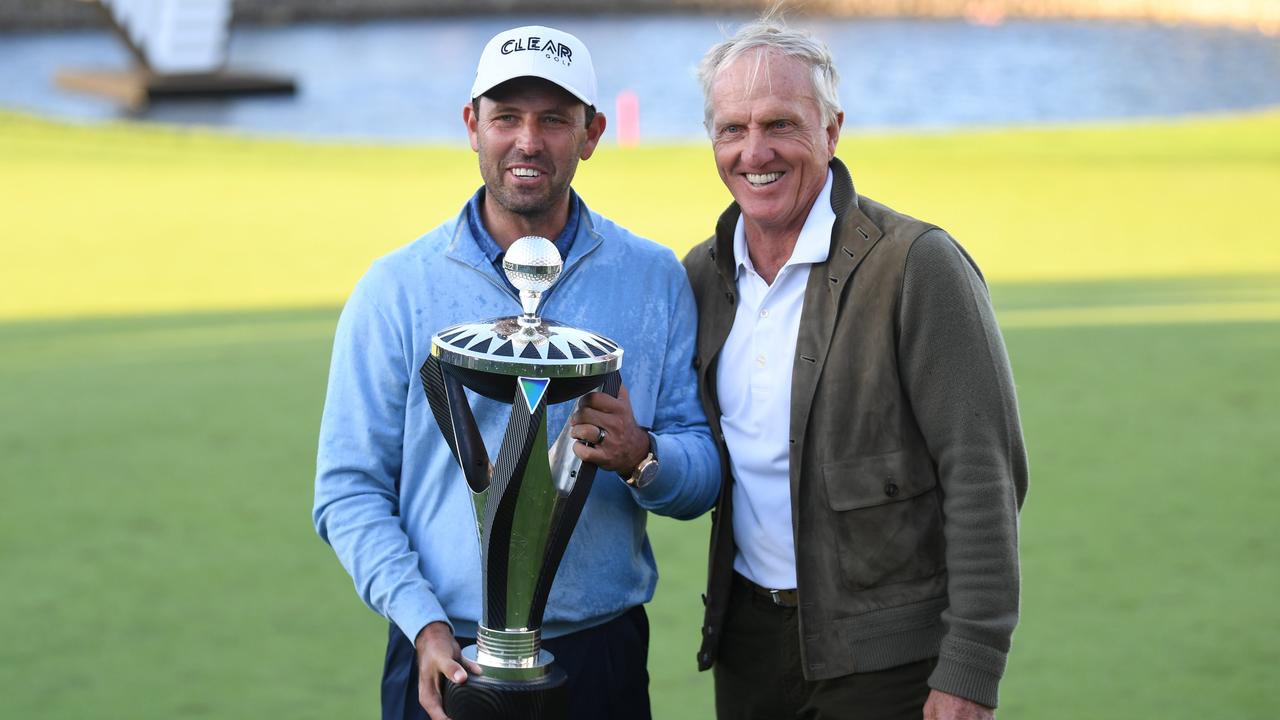 Charles Schwartzell (left) and Greg Norman (right) pose with the trophy after winning the LIV Golf Invitational Series in London.