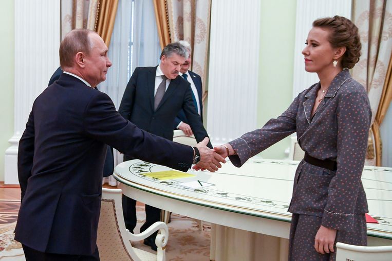 Sobchak in the Kremlin with Vladimir Putin, rumored to be her godfather, during the 2018 presidential election campaign, when she was an opposition candidate.  Statue of Yuri Kadunov / Associated Press