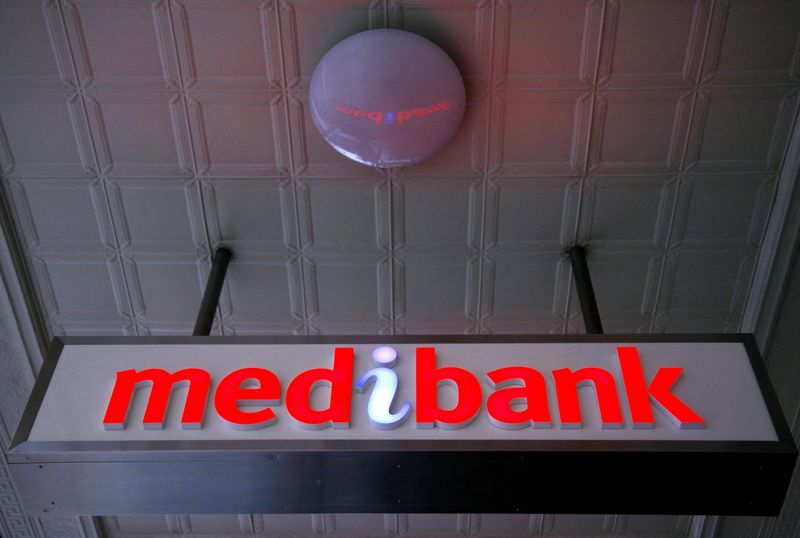 FILE PHOTO: FILE PHOTO: An illuminated sign is seen outside a branch of the Australian health insurer Medibank Private in Sydney