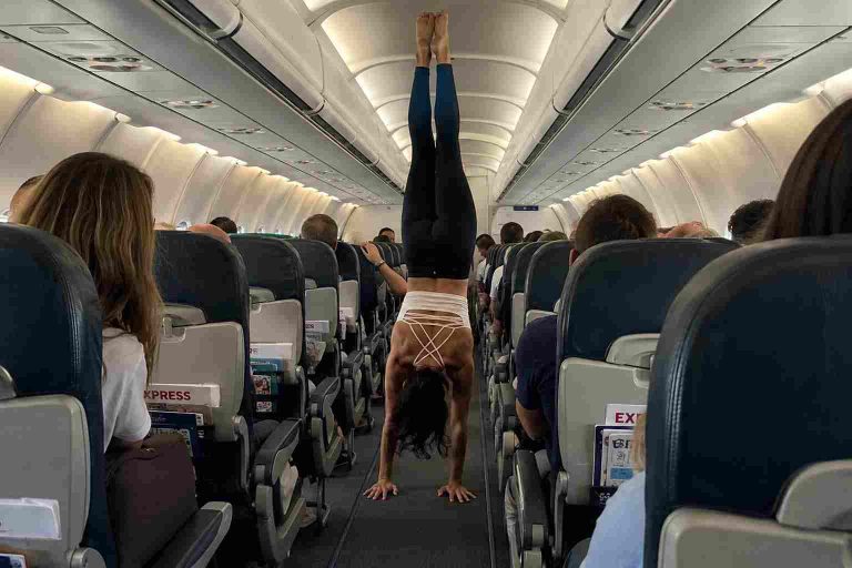 Influencer Performs Yoga in Aircraft Aisle on Iberia Express Flight, Sparking Safety Debate